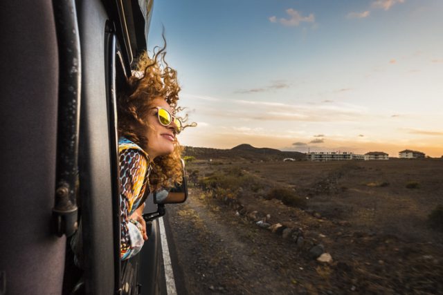 A beautiful young women enjoy her train-trip to Europe 