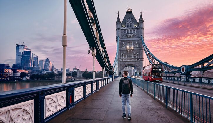 A visitor passing through the London bridge while travelling in uk