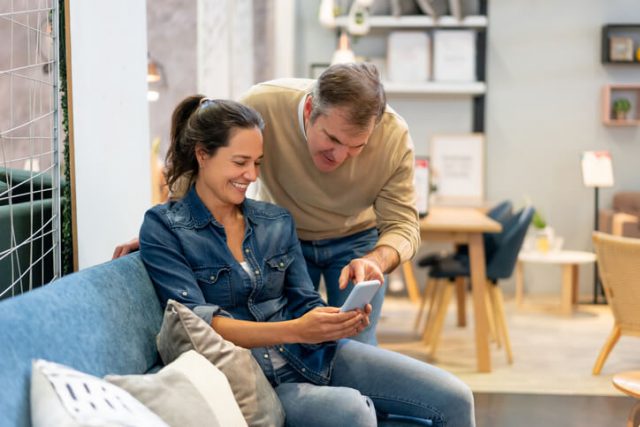 A young couple checking her phone