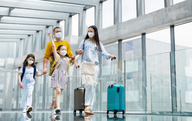 A family is departing at the airport for international travel