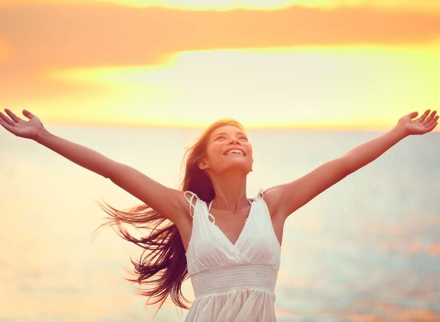 financial independent woman enjoying at beach