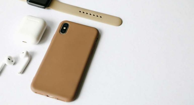mobile phone with brown case and other accessories