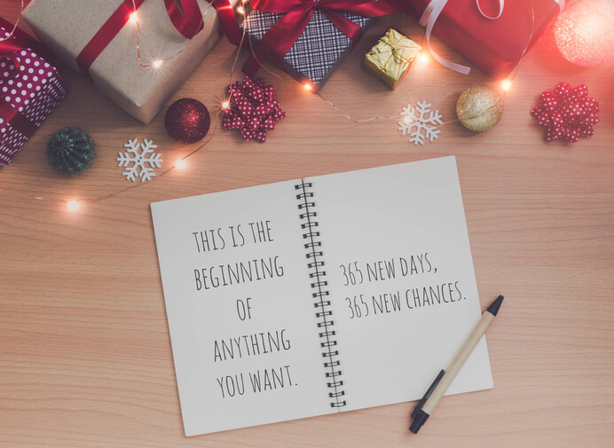 Motivation and inspiration quote on Note book and pen with Christmas and New Year holidays gift box with