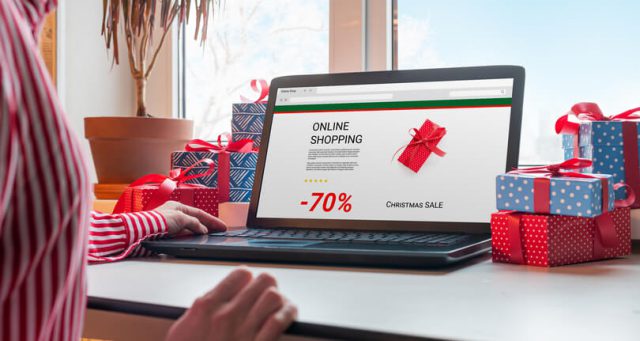 a women shopping online for Christmas via her laptop